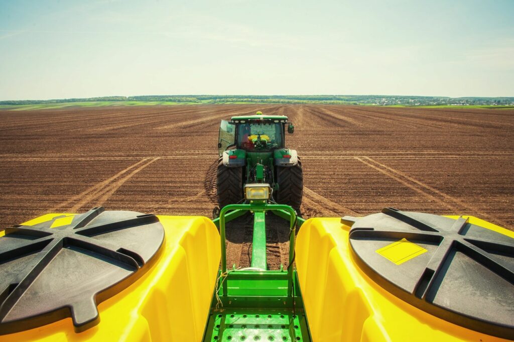 Tractor plowing fields using nylon application in its equipment
